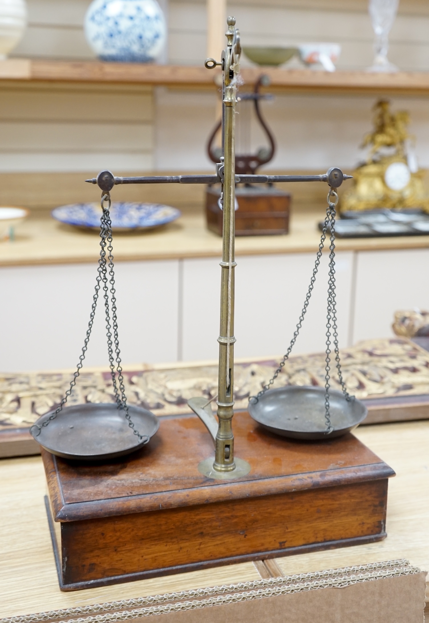 A set of Victorian mahogany and brass beam scales, by Avery, with a repair letter dated 1940 included, 45cm high. Condition - fair